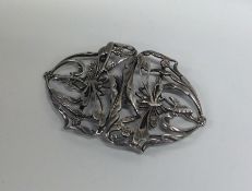 An Edwardian Art Nouveau silver nurse's buckle. Ap