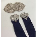 An attractive embossed silver nurse's buckle decor