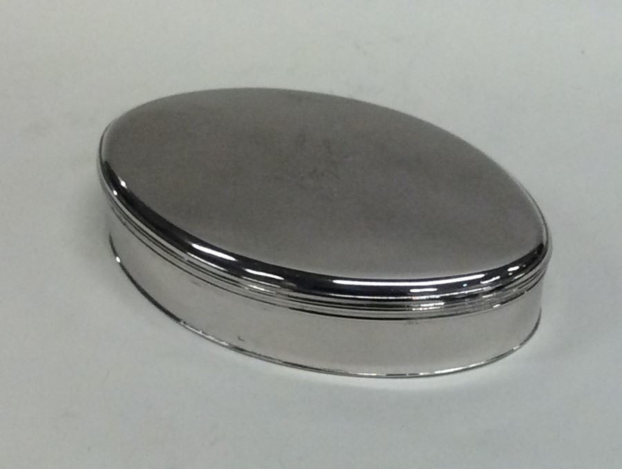 A good oval Georgian silver box with crested hinge