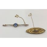 A gold and blue stone bar brooch together with one