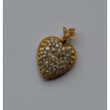 A high carat gold heart shaped pendant attractivel