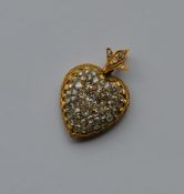 A high carat gold heart shaped pendant attractivel
