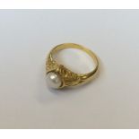 A heavy diamond and pearl gypsy ring. Approx. 6.8