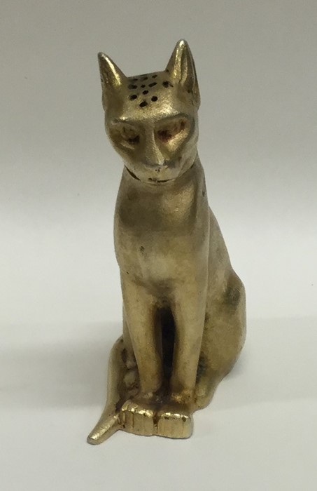A good quality silver gilt model of a seated cat w