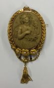 A massive oval lava cameo of a lady with pearl mou