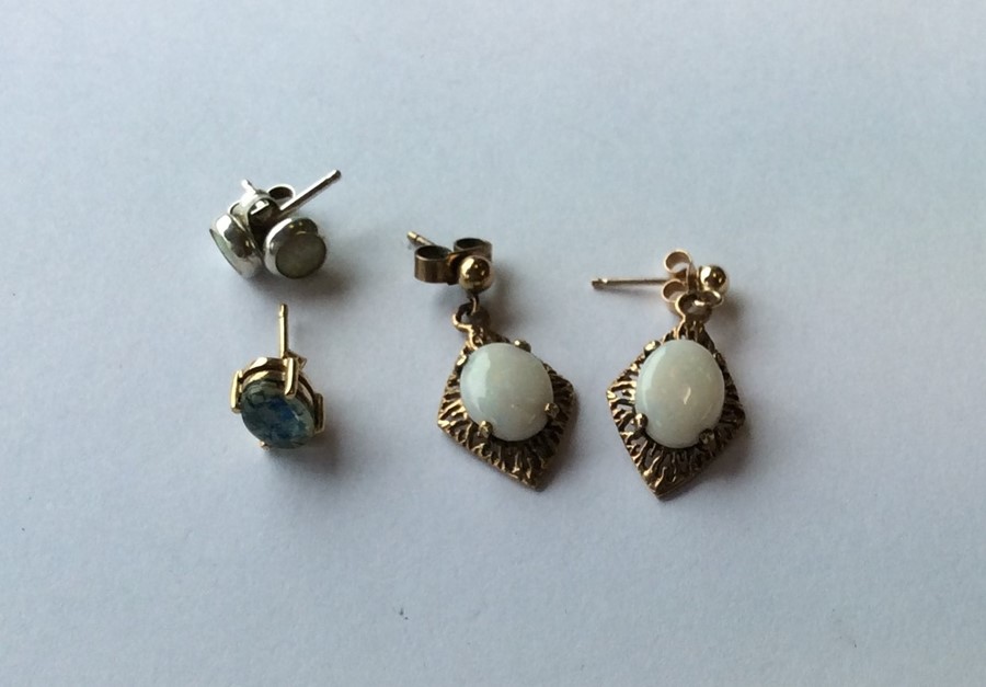Two pairs of opal ear studs in 9 carat mounts. App