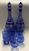 A good pair of blue glass decanters together with