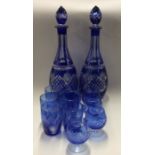 A good pair of blue glass decanters together with