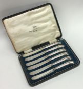 A boxed set of six silver pistol handled tea knive