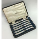 A boxed set of six silver pistol handled tea knive