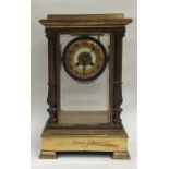 A tall French brass mounted mantle clock with beve