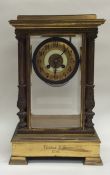 A tall French brass mounted mantle clock with beve