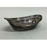 An Edwardian silver oval sweet dish decorated with