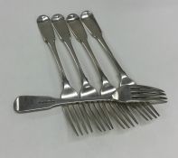 Five Georgian silver fiddle pattern table forks. L