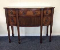 A Georgian style mahogany shaped front sideboard w