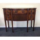 A Georgian style mahogany shaped front sideboard w