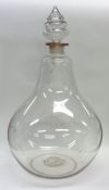 A massive glass chemist's bottle with removable st