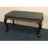 A Chippendale style upholstered mahogany stool wit