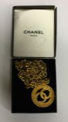 CHANEL: A boxed gilt necklace together with matchi