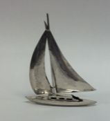 A novelty silver model of a yacht on flat base. Ap