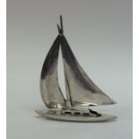 A novelty silver model of a yacht on flat base. Ap