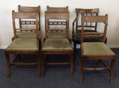 A set of five Georgian dining chairs with slip-in