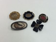 A bag containing Antique mourning brooches togethe