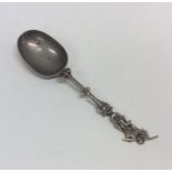 A Continental silver spoon mounted with a figure.