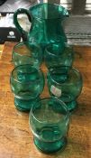 A decorative green glass lemonade set of baluster