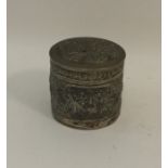 A cylindrical Indian silver box and cover. Approx.
