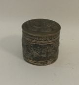 A cylindrical Indian silver box and cover. Approx.