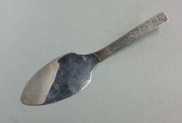 A stylish modern silver butter knife. London. By M