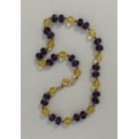 An attractive silver, amethyst and citrine necklac