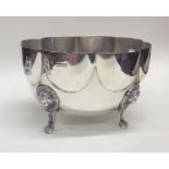 A large Edwardian silver bowl decorated on four ha