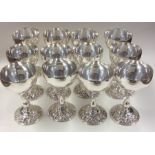 A good set of twelve EPNS spirit goblets with flor