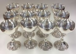 A good set of twelve EPNS spirit goblets with flor