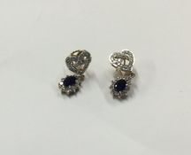 A pair of sapphire and diamond drop earrings with