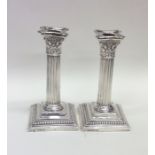 A good pair of Corinthian column silver candlestic