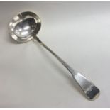 A heavy Scottish silver fiddle pattern soup ladle.