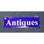 An old blue enamel sign entitled, 'Antiques'. Appr