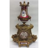 An attractive French mantle clock with floral deco