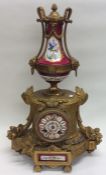 An attractive French mantle clock with floral deco