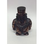 A novelty cast money box in the form of a portly g