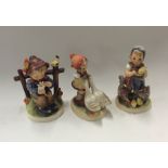 A group of three Goebel figures of children. Est.