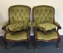 A pair of Victorian button back chairs together wi