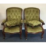 A pair of Victorian button back chairs together wi