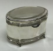 A Continental silver tea caddy on bracket feet to