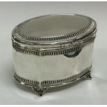 A Continental silver tea caddy on bracket feet to