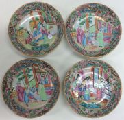 A set of four Chinese Canton dishes decorated with