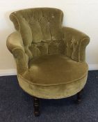 A green upholstered button back armchair. Est. £30